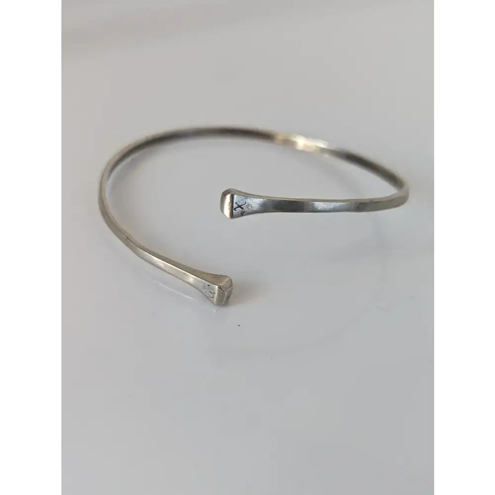 Silver steed hoofnail hammered sterling silver cuff bangle with open minimalist design and subtle engravings