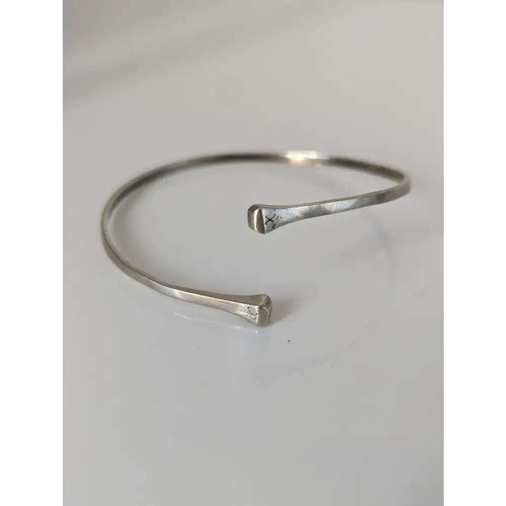 Silver steed hoofnail sterling silver cuff bangle with hammered texture and minimalist open-ended design