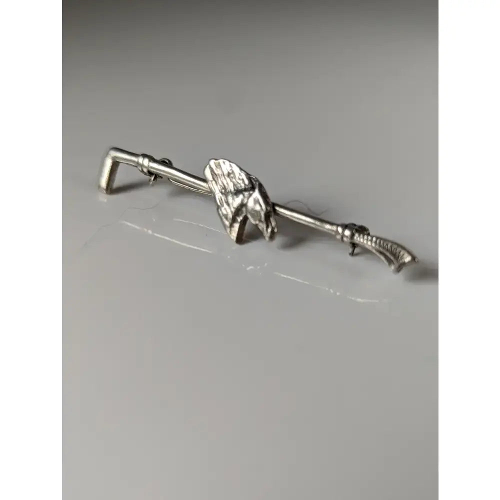 Silver steed horse cane brooch with detailed mane mounted on a slender metal bar stock tie pin