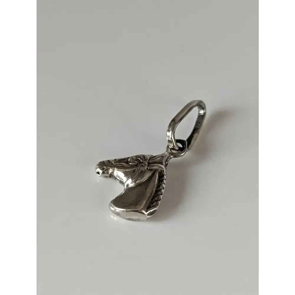 Silver steed horse head silver pendant with detailed engraving and polished metallic finish silver pendant
