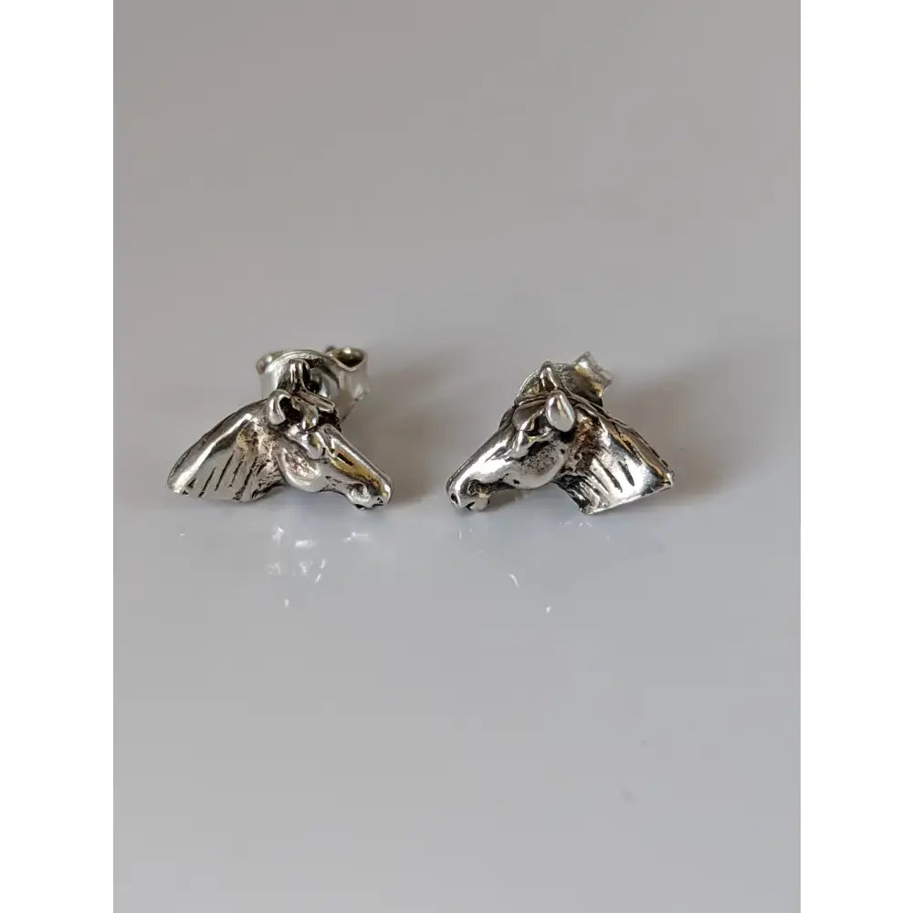 Silver steed horse head stud earrings in solid silver with detailed sculpted features for stylish wear