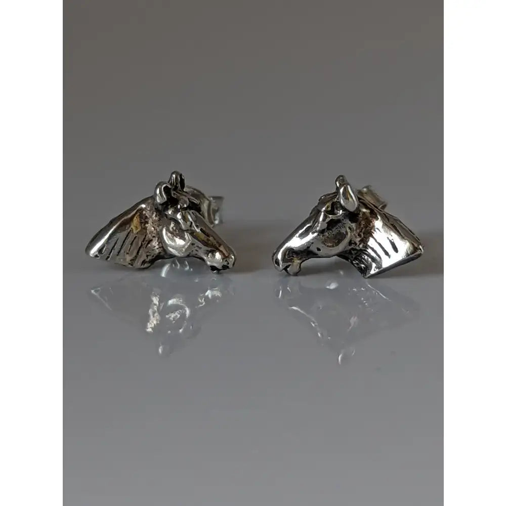 Silver steed horse head stud earrings featuring detailed solid silver horse faces with textured metal finish