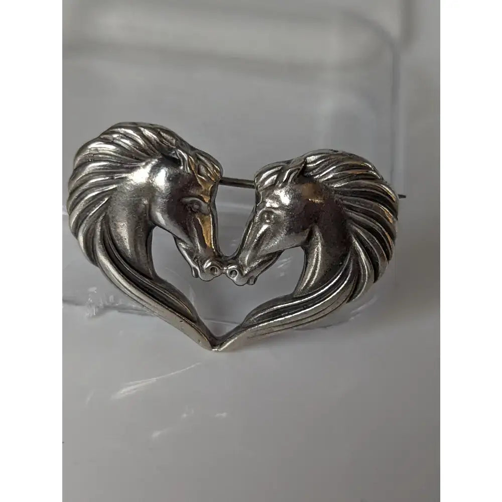 Silver steed horse stock tie pin in silver tone with two detailed horse heads forming a heart shape mane design