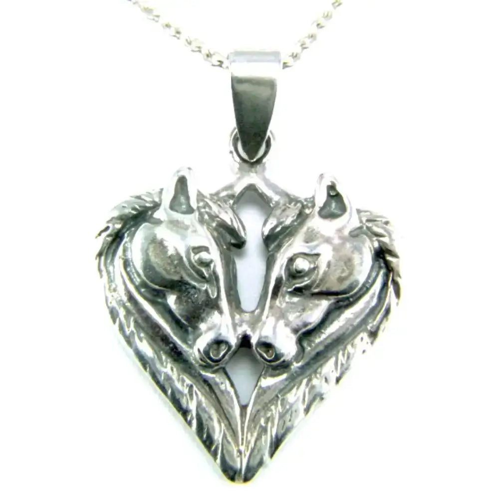 Silver steed horse heart pendant necklace featuring silver wolf-faced horse heads in a sleek heart design