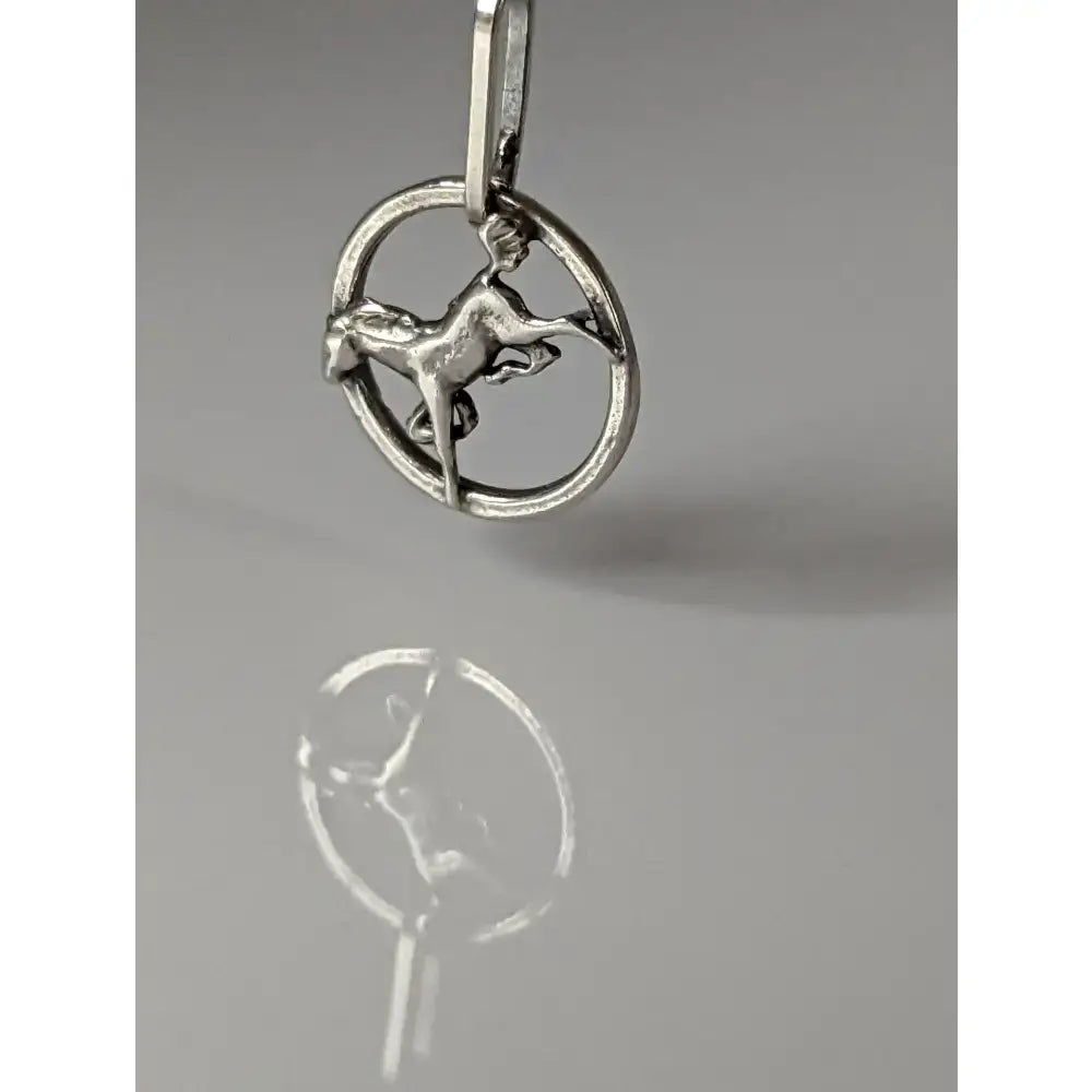 Silver steed horse silver pendant with detailed galloping steed inside a circular silver frame