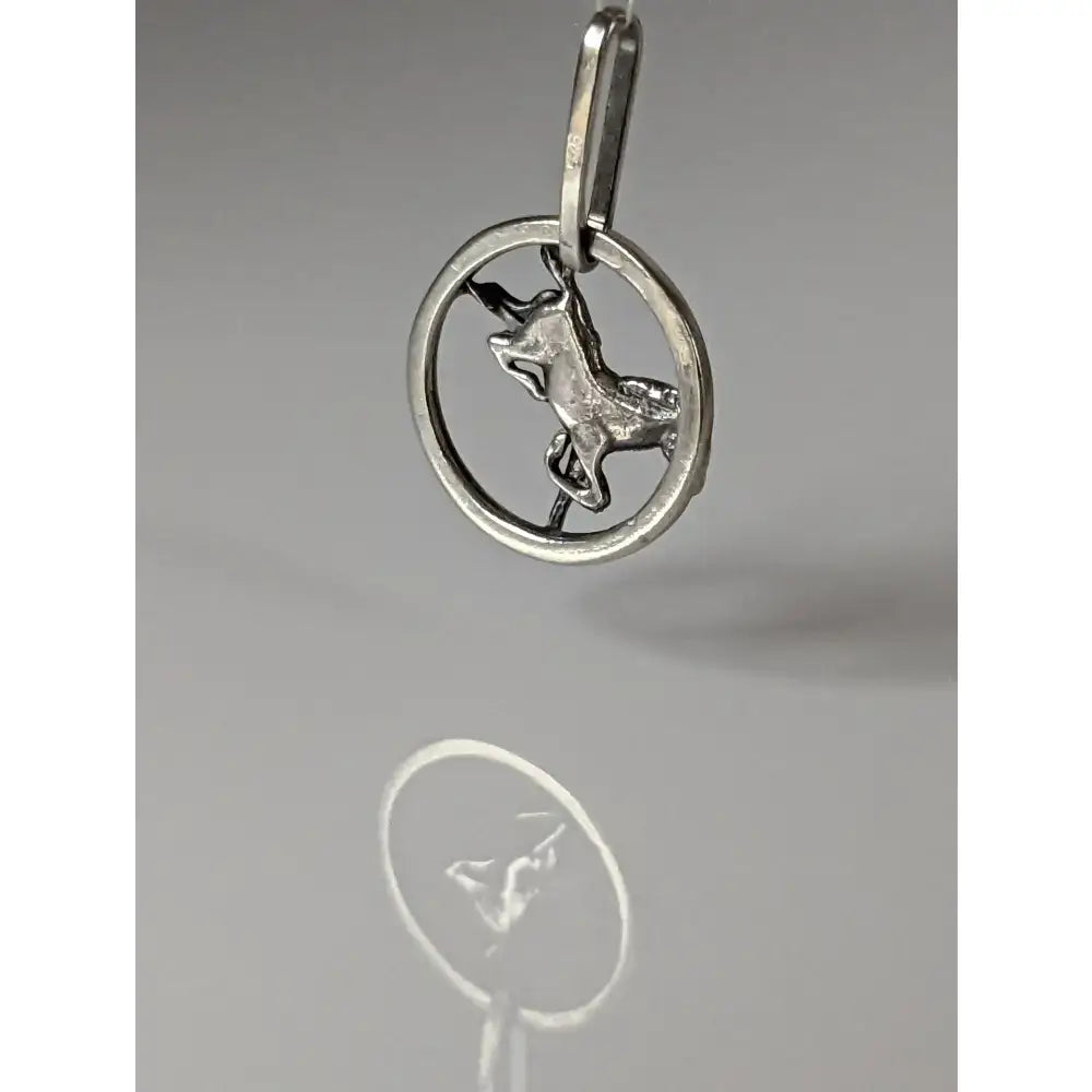 Silver steed horse pendant in silver features a detailed sculpted unicorn inside a circular frame