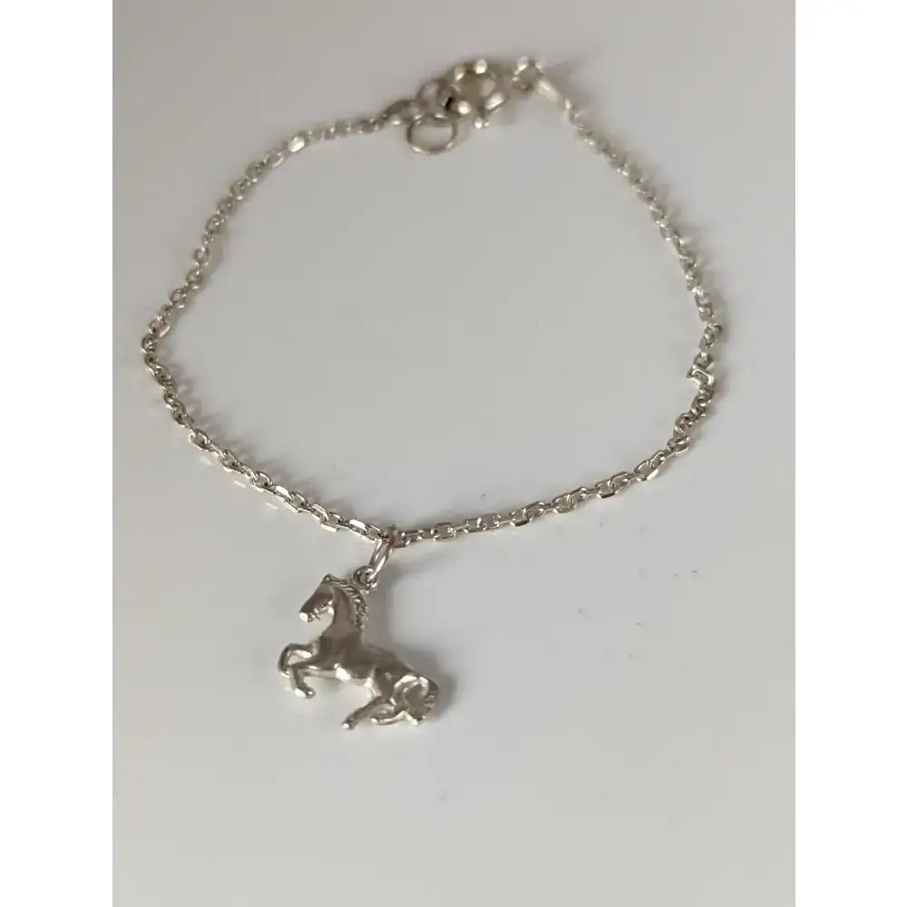 Silver steed sterling silver chain delicate bracelet featuring a detailed horse charm with a twisted chain and clasp