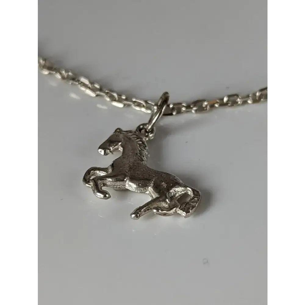 Silver steed horse on a chain delicate bracelet featuring a detailed horse charm in sterling silver