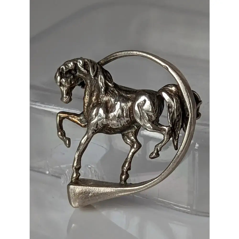 Silver steed horse hoofnail silver brooch in a dynamic rearing pose perfect for an equestrian stock tie pin