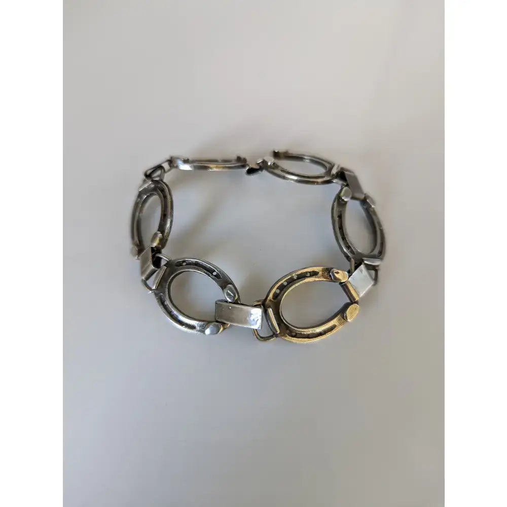 Silver steed horseshoe two-tone silver and gold horseshoe bracelet with polished finish perfect equestrian jewelry