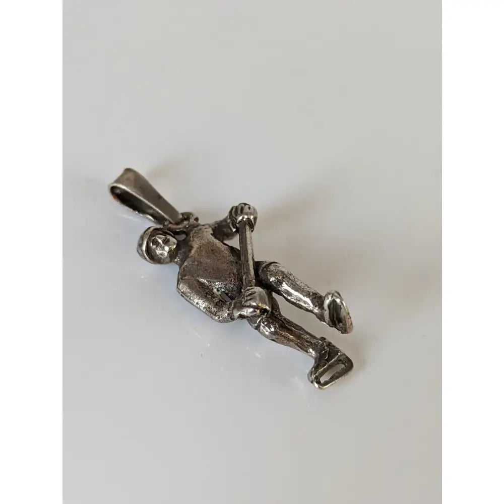 Silver steed ice hockey silver pendant in silver metal showing a miniature figure in an ice skating pose for sports fans