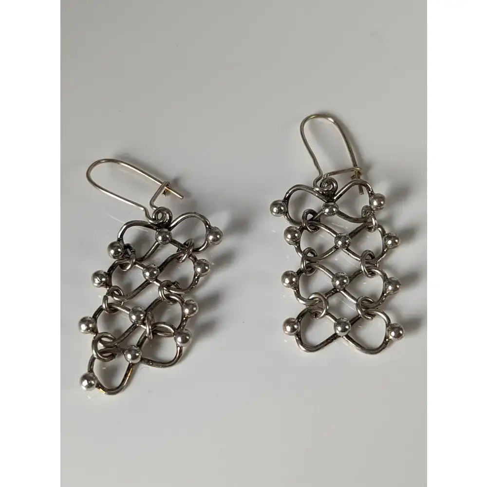 Silver steed infinity chain dropped earrings in silver with cascading geometric loops and small spherical beads