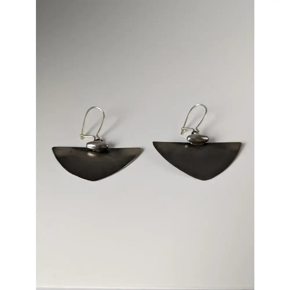 Silver steed isosceles dropped earrings in silver tone with a matte finish and subtle textured detail