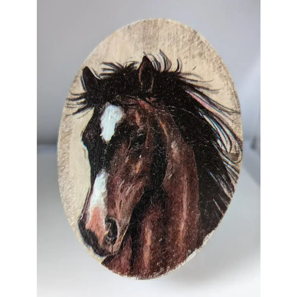 An oval wooden plaque with a detailed dark brown horse painting in silver steed jewellery oval boxes collection