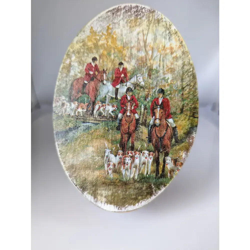 Oval ceramic plate from silver steed jewellery featuring painted scene of riders in red coats with hounds in autumn forest for oval boxes