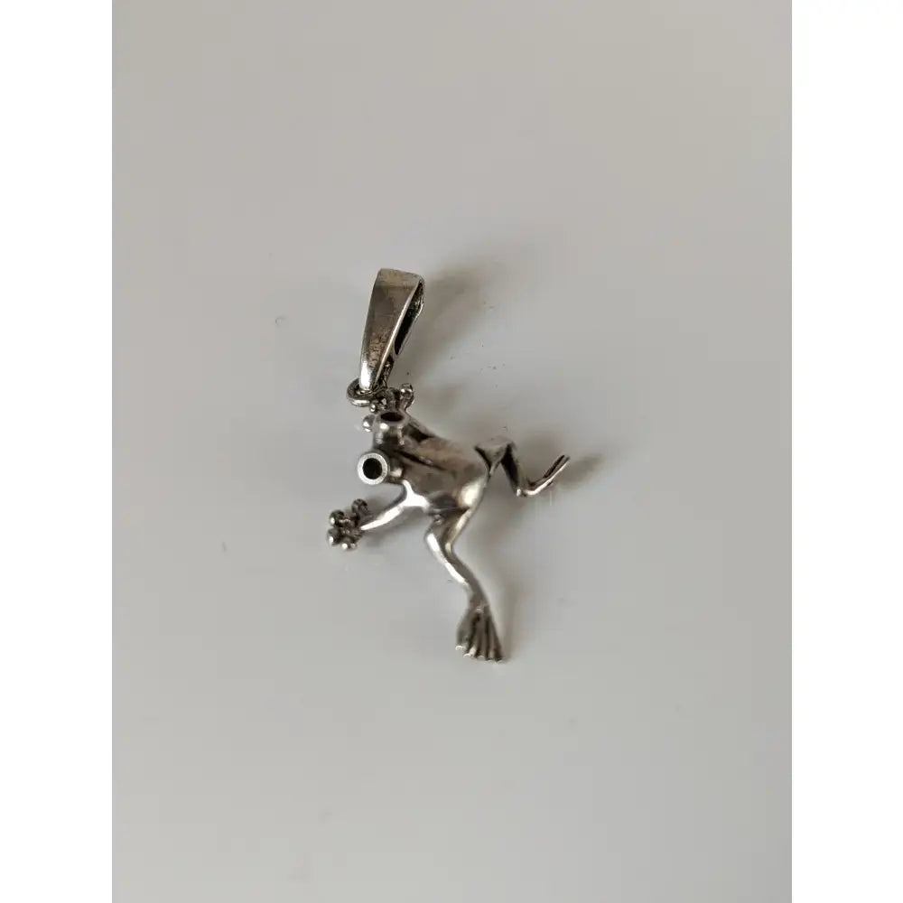 Silver steed jumping frog pendant silver with detailed limbs and black bead eye made of sterling silver frog jewelry