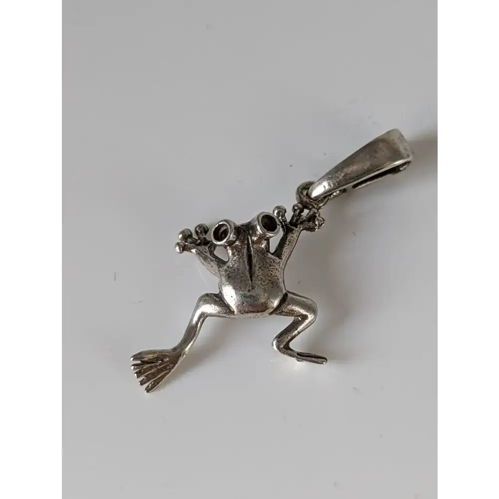 Silver steed jumping frog pendant silver with detailed limbs and textured surface in sterling silver frog design