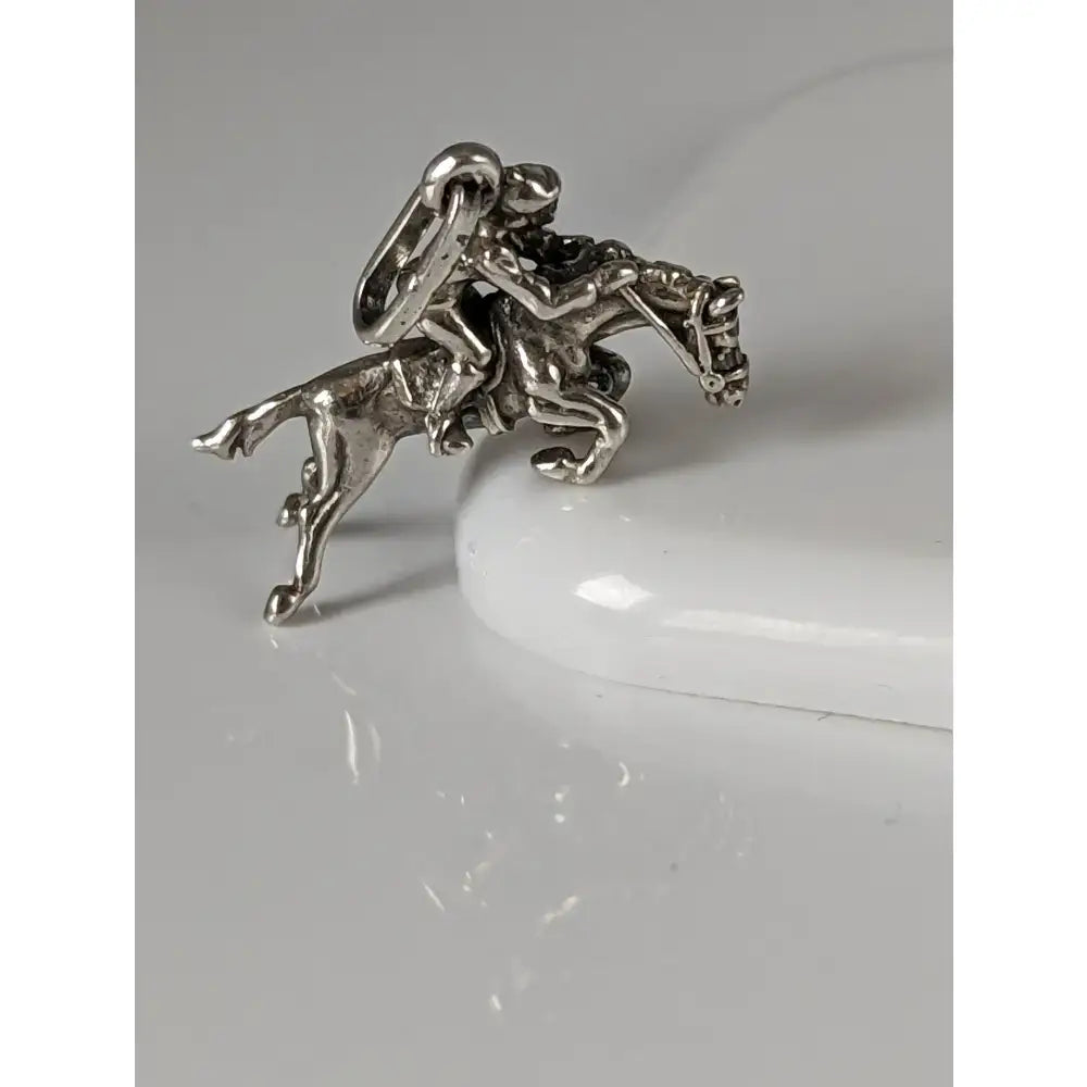 Silver steed jumping jockey silver pendant charm with intricate detailing and polished silver metallic finish