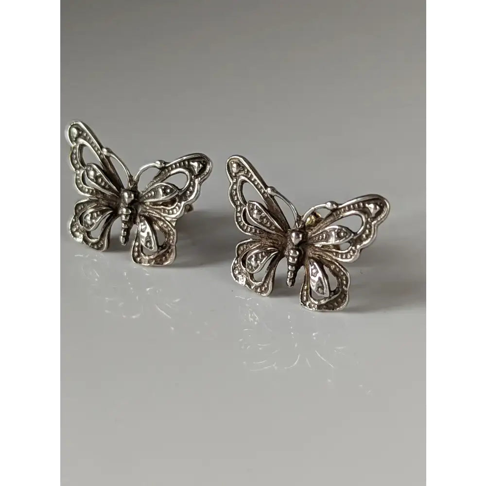 Silver steed large butterfly stud earrings with intricate filigree detailing and vintage-inspired silver design
