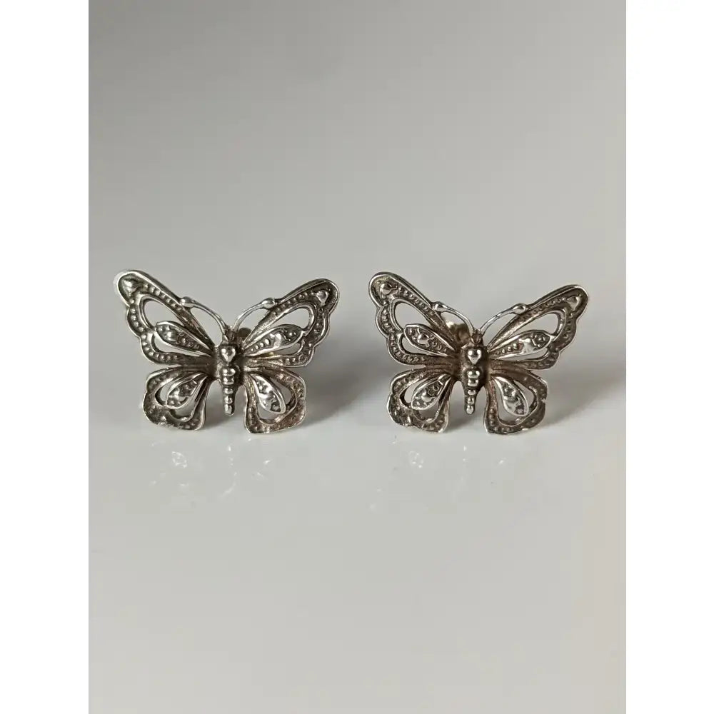 Silver steed large butterfly stud earrings with intricate filigree detailing in silver vintage-inspired design