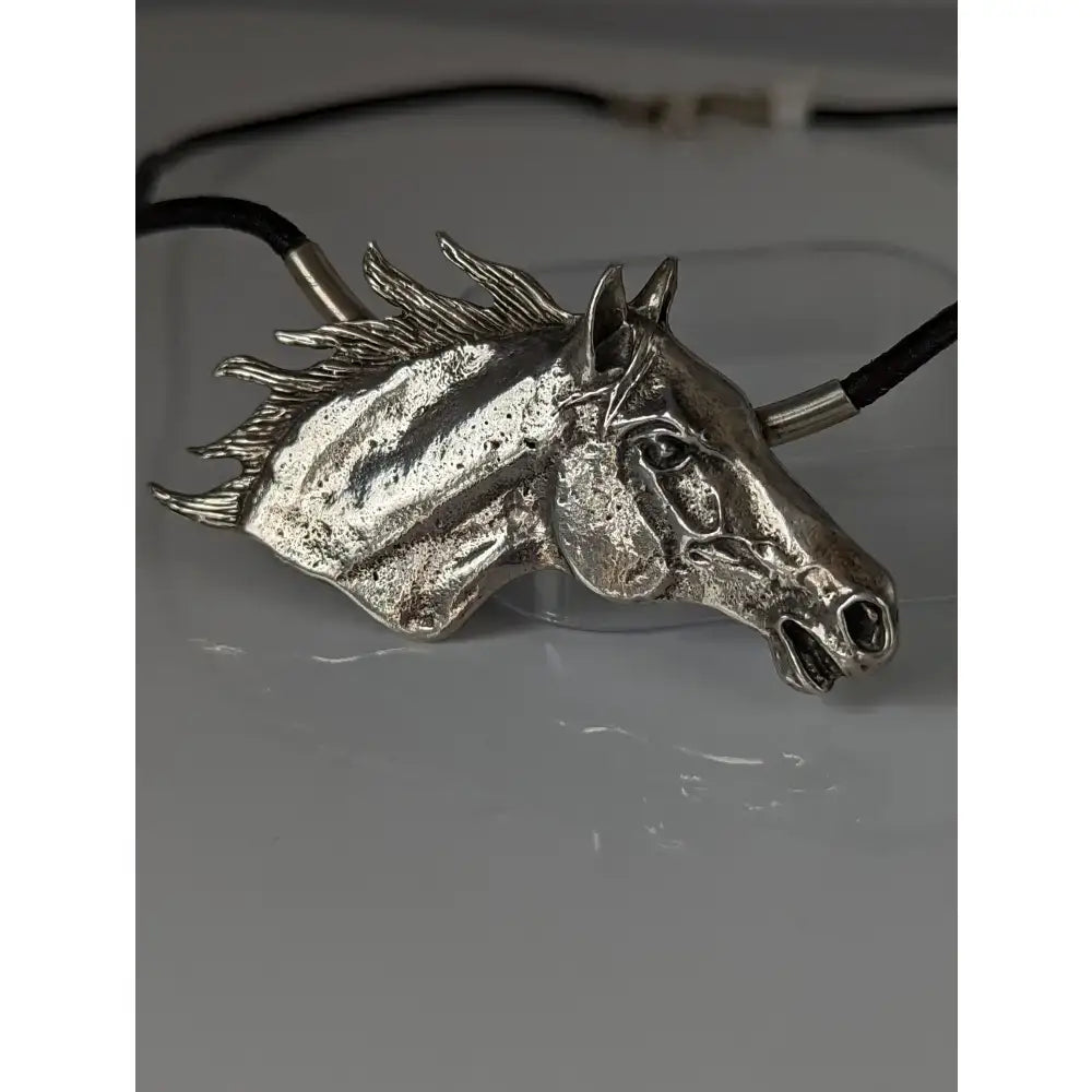 Silver steed large silver horse head pendant with detailed mane on a black leather cord necklace for equestrian fans