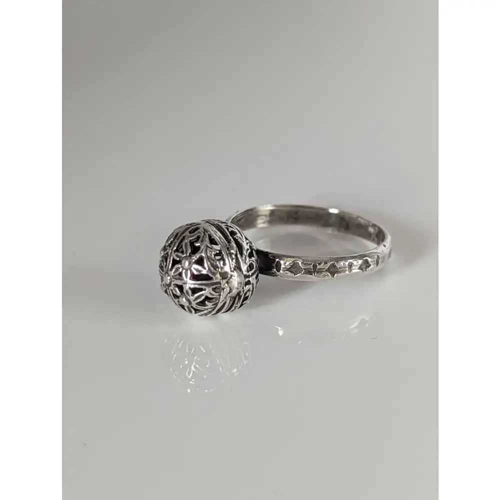 Silver steed large handmade silver ring with unique ball centerpiece featuring intricate lace like filigree patterns