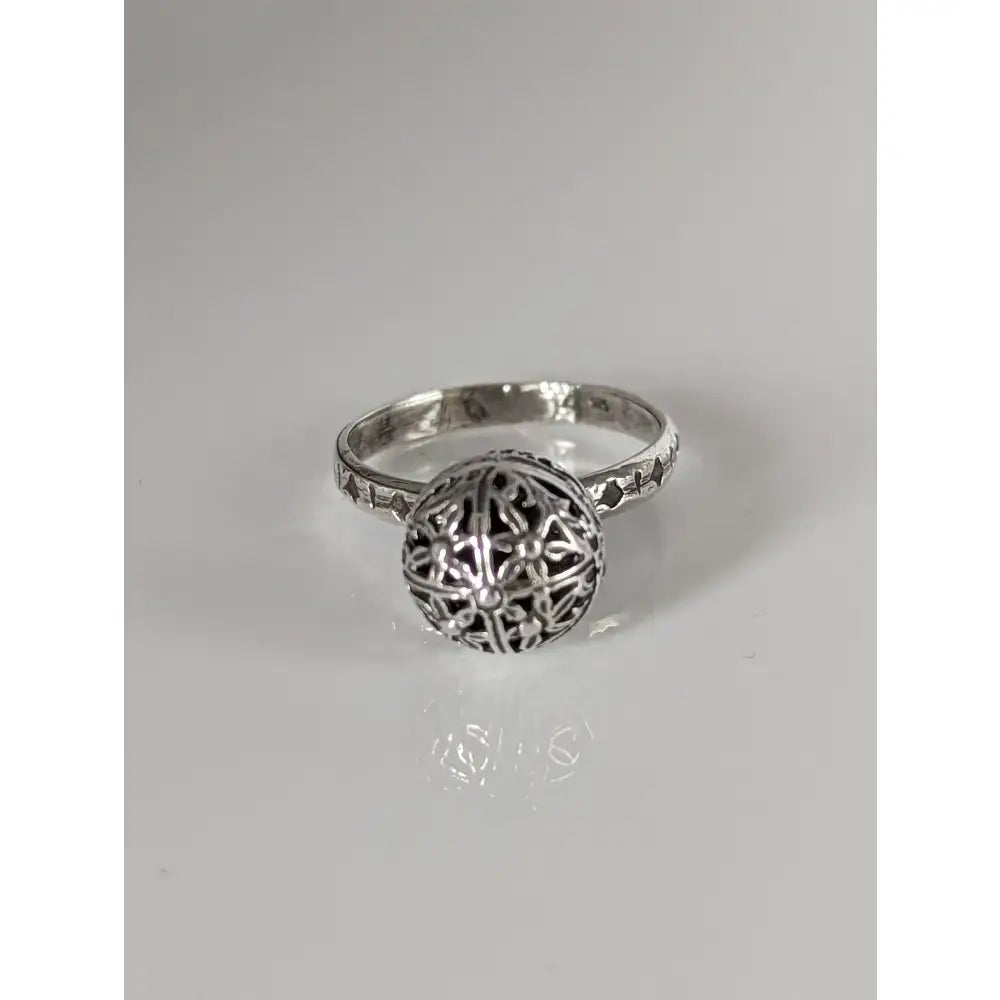 Silver steed large handmade silver ring with unique ball centerpiece and intricate filigree patterns