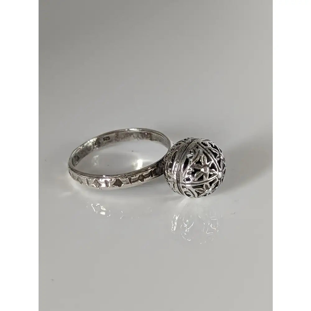 Silver steed large handmade silver ring with a unique ball handmade filigree charm attached to the band