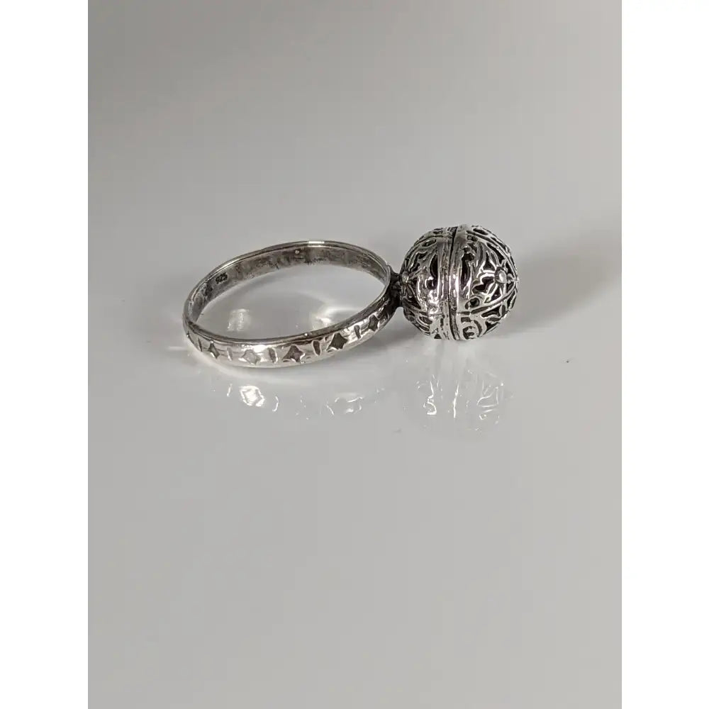 Silver steed large handmade silver ring with a unique ball filigree-patterned charm attached to the band