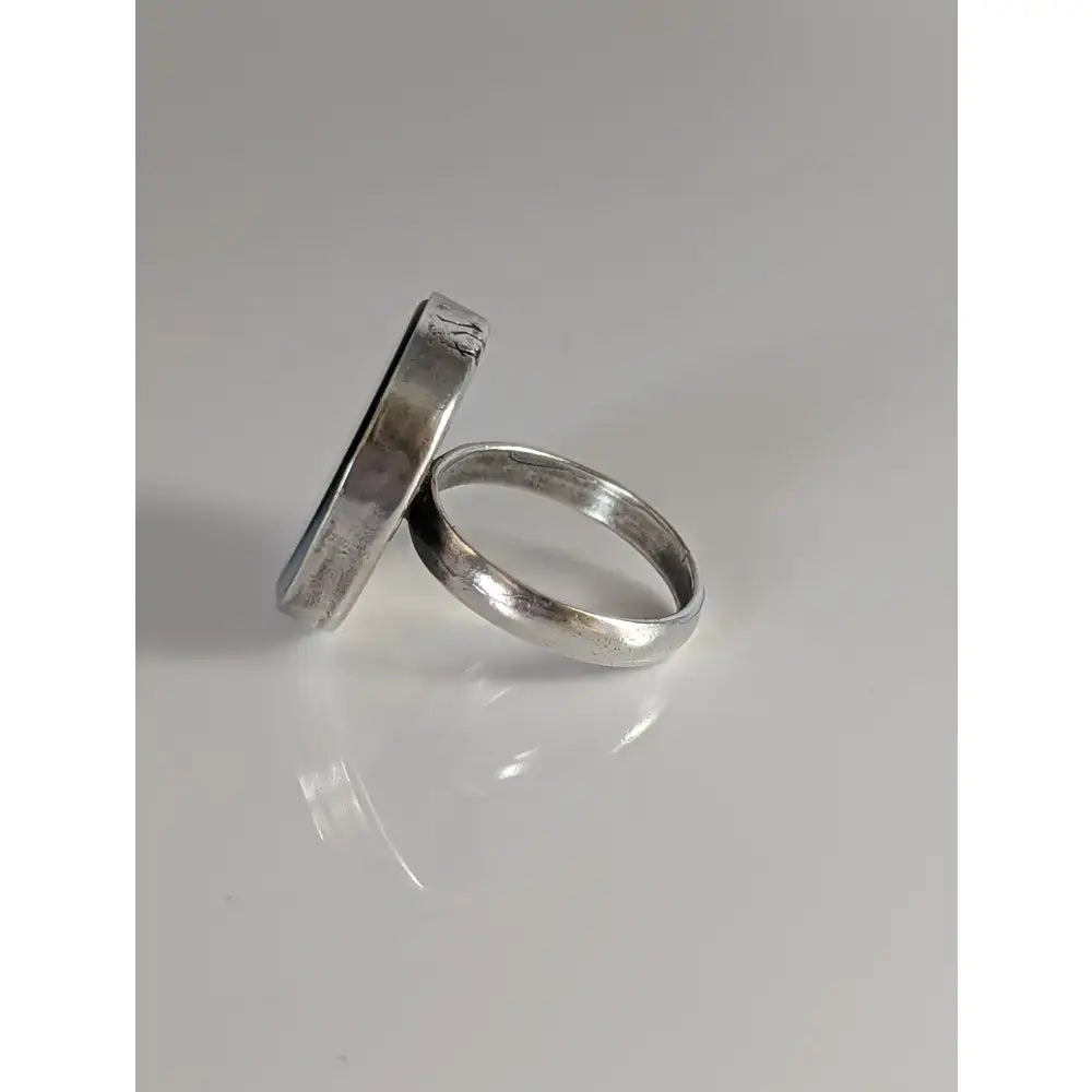 Two silver steed large rings with a unique black silver ring design and textured sterling silver white mass finish