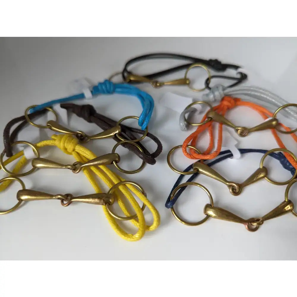 Colorful silver steed leather snaffle cord bracelet with brass horsebit charms for a stylish everyday look