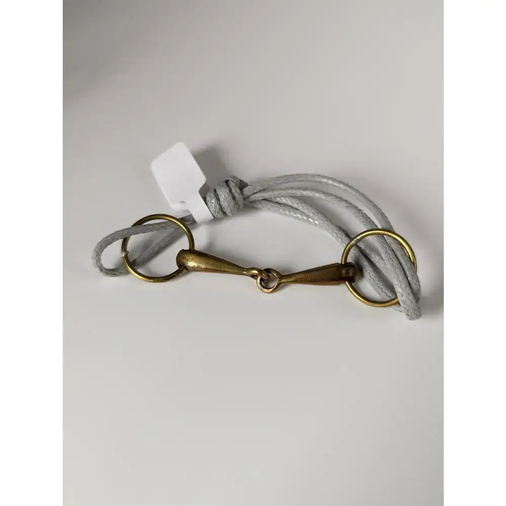 Gray braided silver steed leather snaffle cord bracelet with a brass snaffle leather horsebit buckle