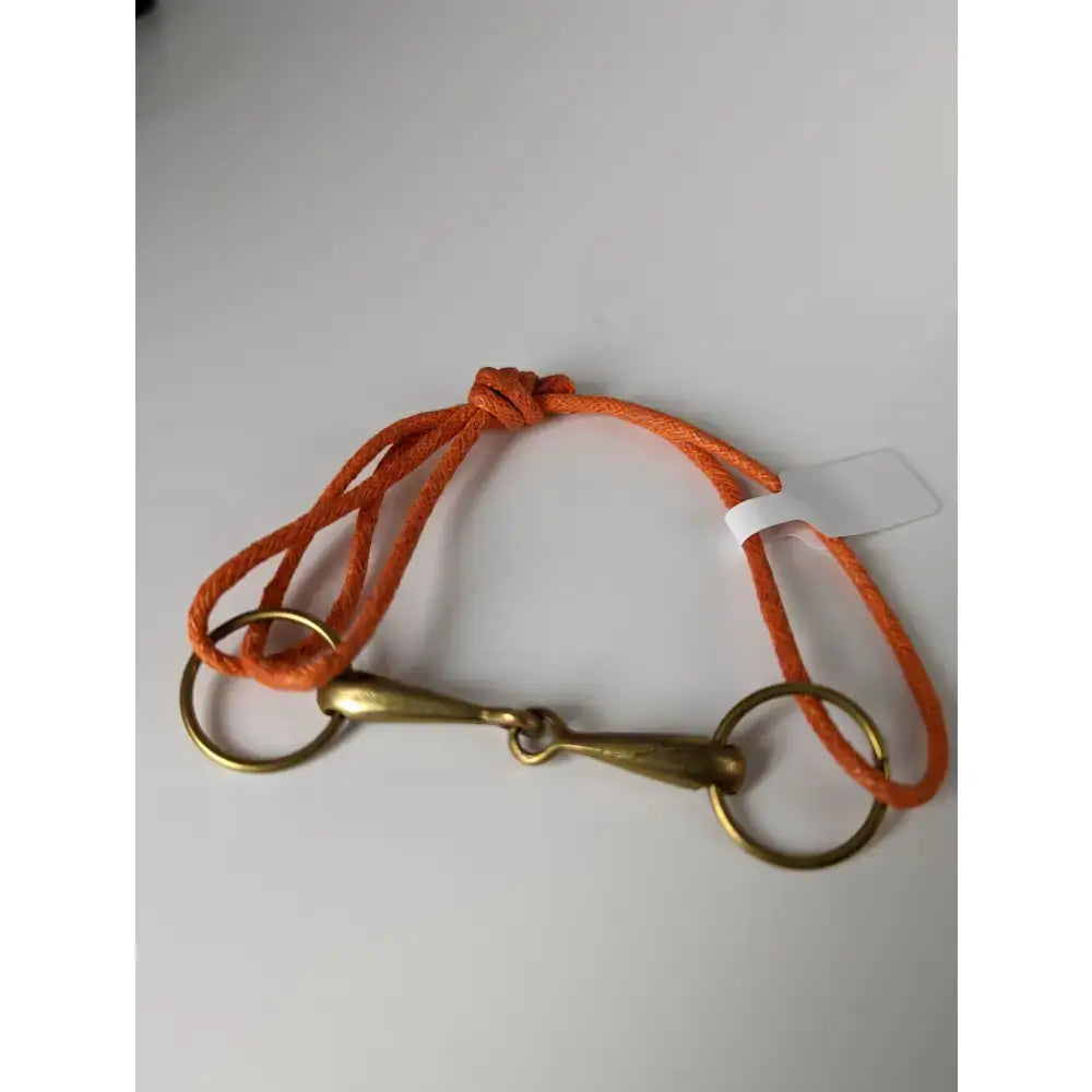 Orange braided rope snaffle cord bracelet with brass horsebit from silver steed leather brass snaffle leather collection