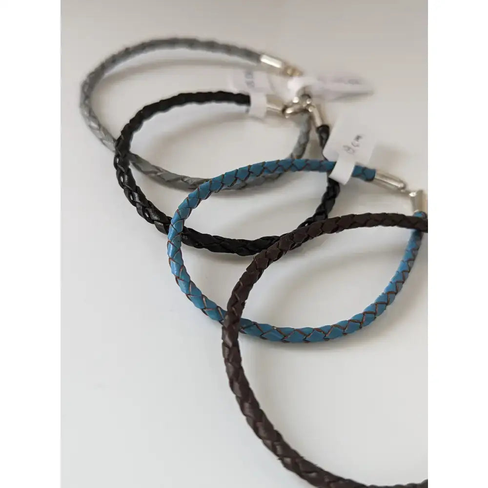 Silver steed leather cord bracelet with three braided leather bracelets in gray black and blue with silver clasps