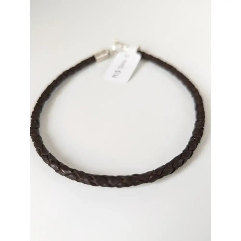 Dark brown braided leather cord bracelet with a silver steed leather silver-toned clasp for everyday wear