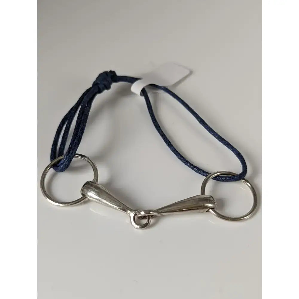 Navy blue leather silver snaffle cord bracelet featuring a silver-toned horsebit design with two circular rings