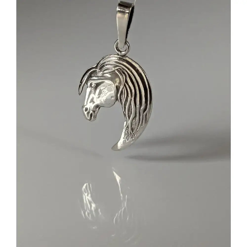 Silver steed long horse head silver pendant with detailed long mane and polished metallic finish