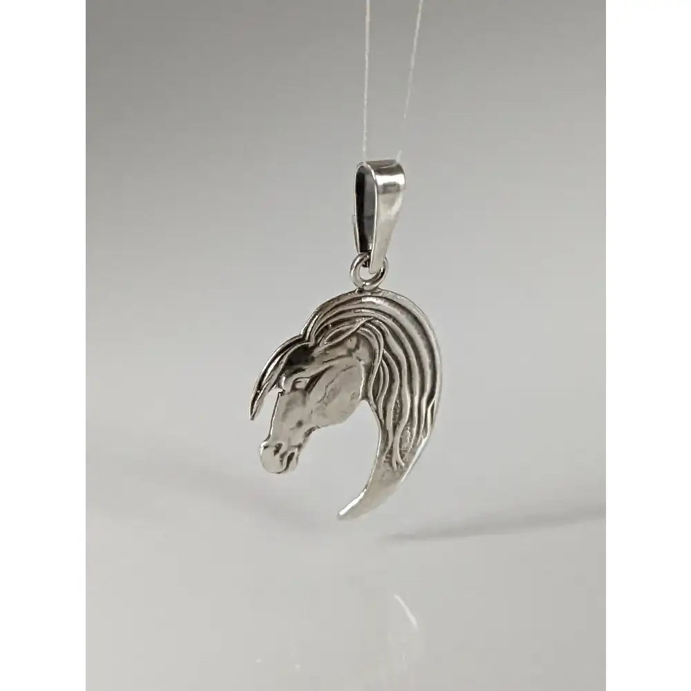 Silver steed long silver horse head silver pendant with detailed long mane and polished metallic finish