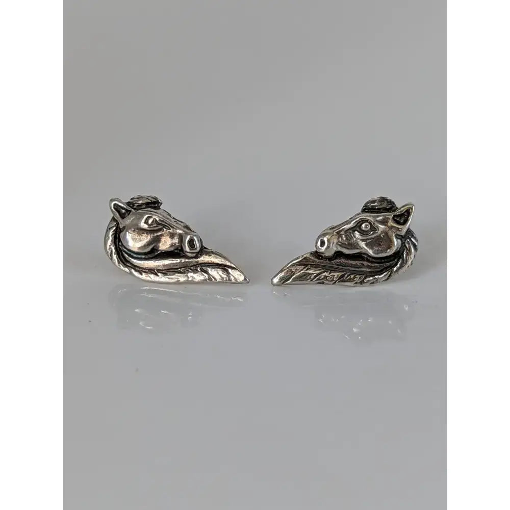 Silver steed horse head studs featuring detailed facial features and flowing mane in shiny silver material