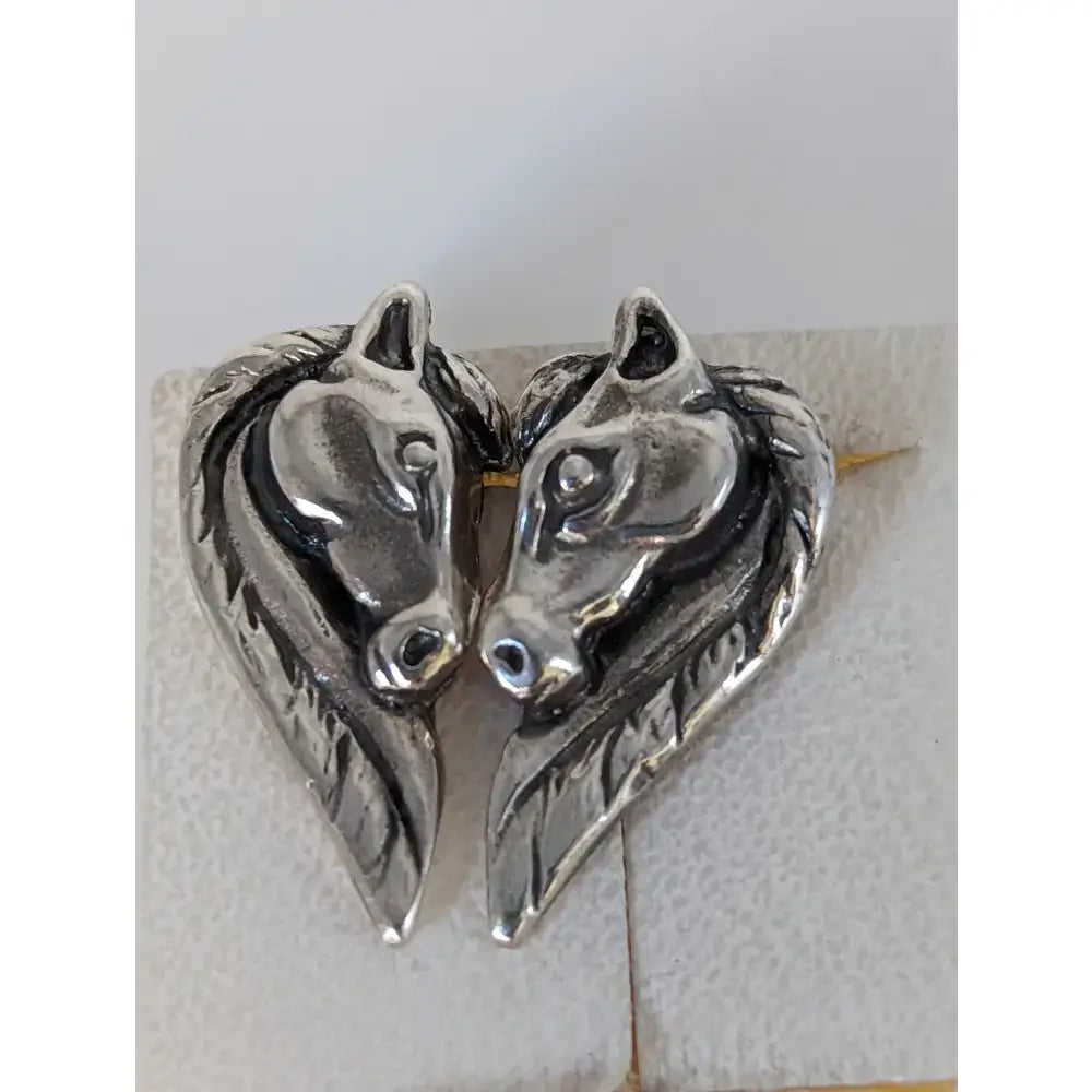 Silver steed horse head studs with long maned horse head design in polished silver tone metal brooch style