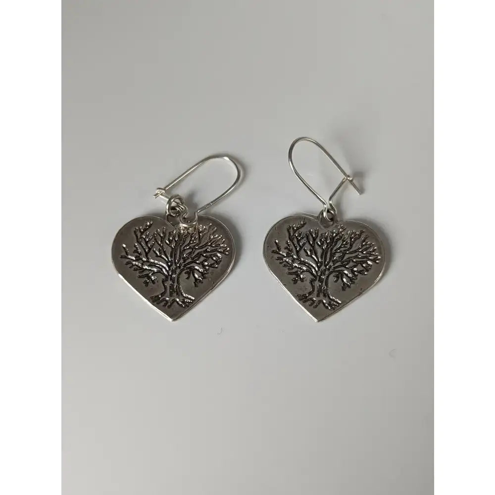 Silver steed love trees dropped earrings featuring silver heart shape with engraved tree of life design