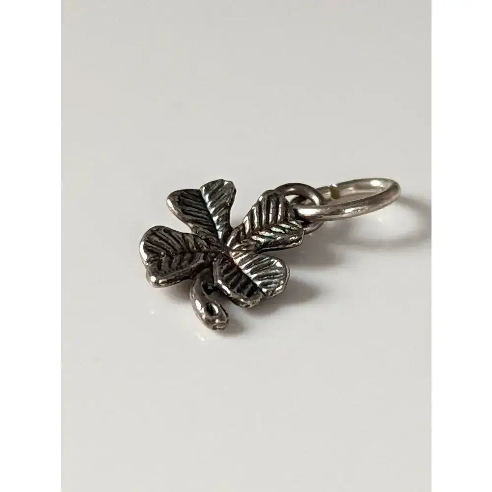 Silver steed lucky four leaf clover silver pendant charm with detailed leaf veins and small loop for attachment
