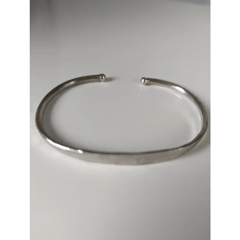 Silver steed magnetic solid silver bracelet with hammered texture and rounded ends in silver tone