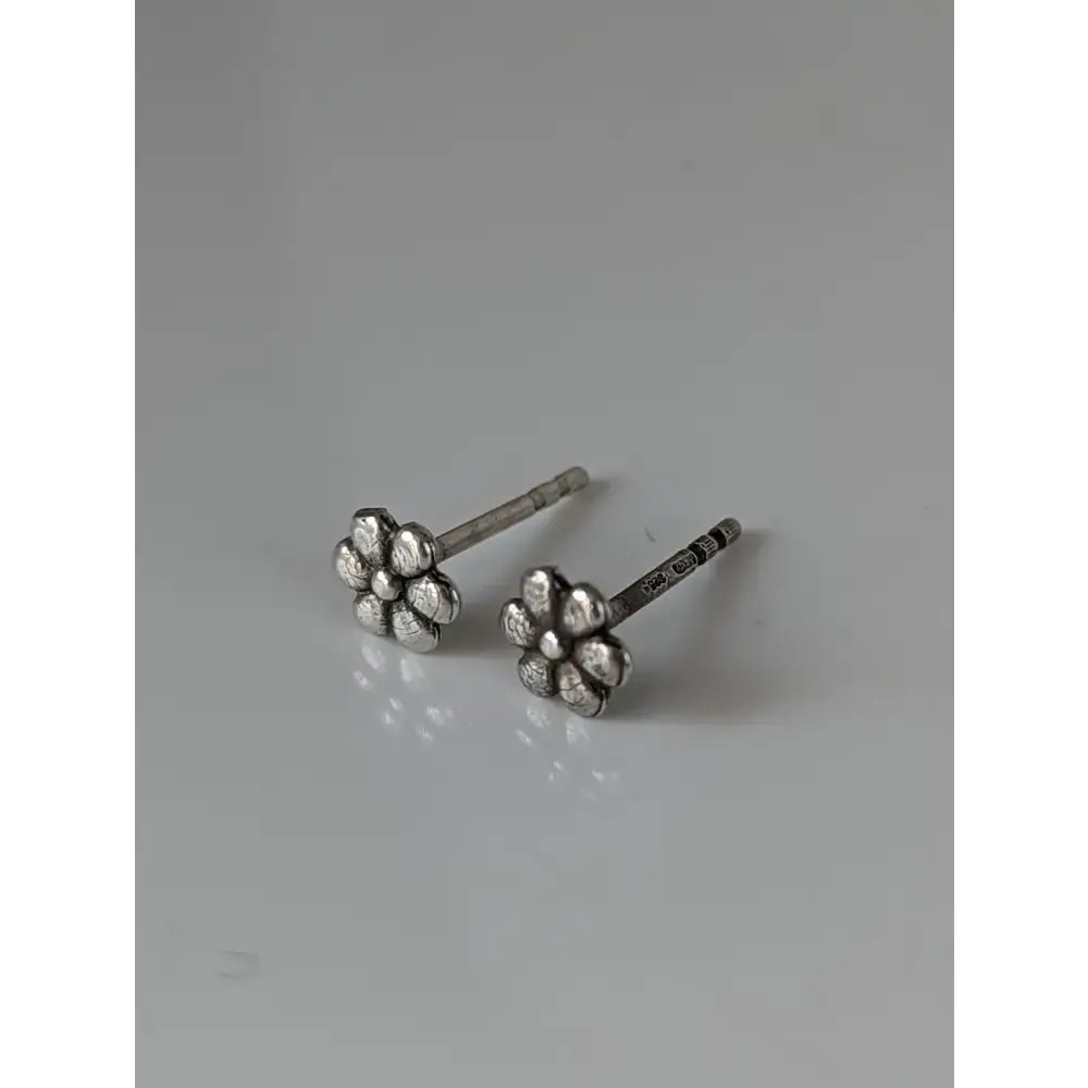 Silver steed margaret silver flower stud earrings with textured petals and simple post design