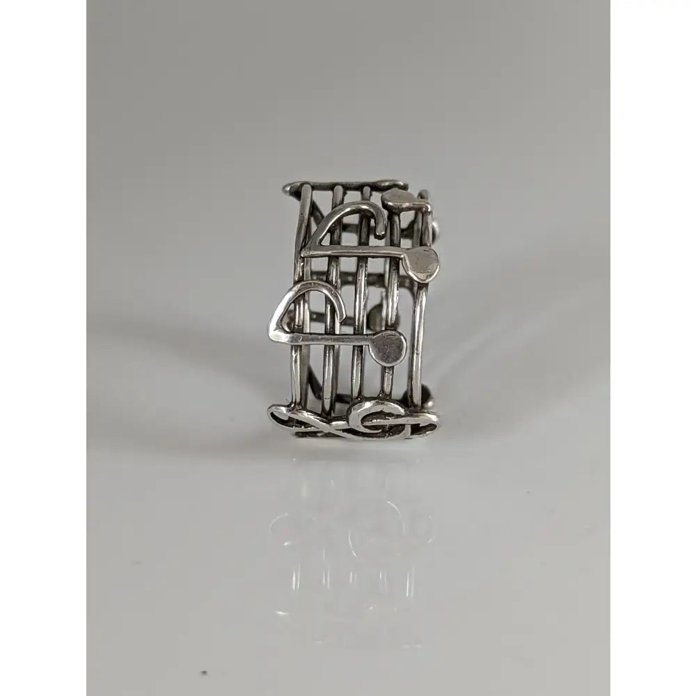 Silver steed music notes band silver ring with intricate wirework design perfect for equestrian jewelry fans