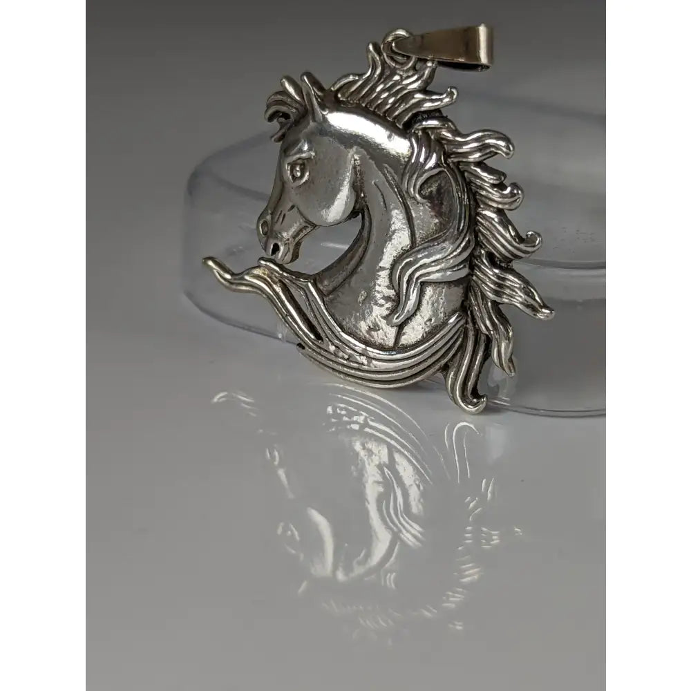 Silver steed mustang horse head silver pendant with intricate mane details and polished metallic finish