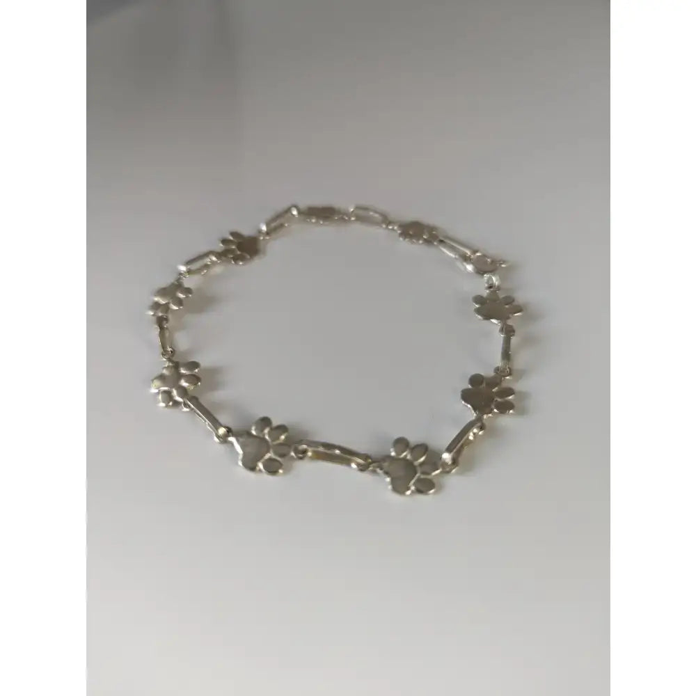Silver steed paw print silver bracelet with delicate sterling silver chain and detailed paw print charm
