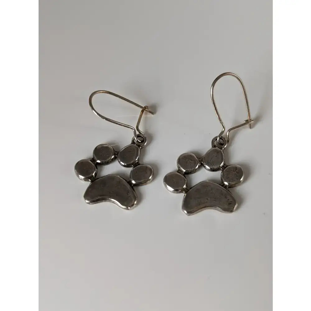 Silver steed paw print silver dropped earrings with polished silver paw print and simple hook closures