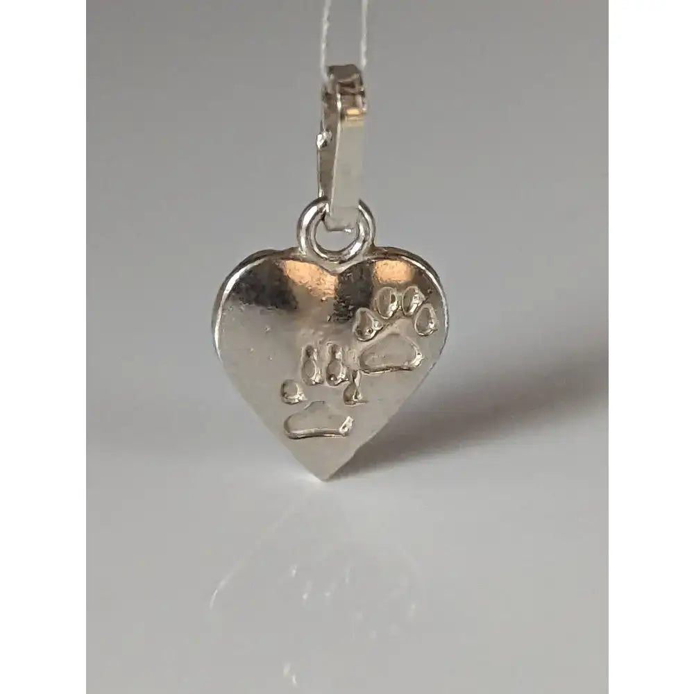 Silver steed heart silver pendant with engraved paw prints in shiny silver metal perfect for pet lovers