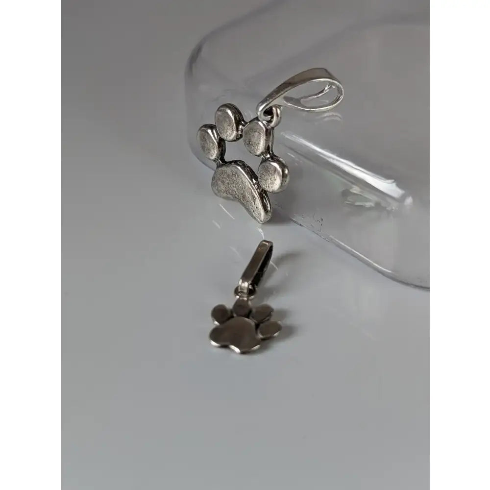 Silver steed paw print silver pendant with textured antiqued finish and polished bail silver pendant accessory